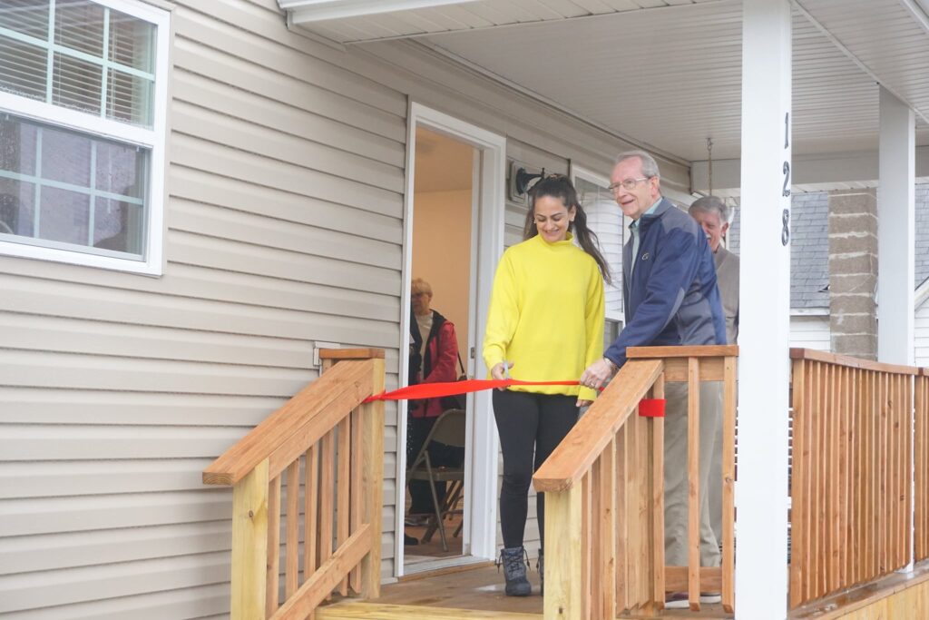 March 2022 home - Carson Street O'Fallon, IL - new homeowner Leia cuts ribbon with O'Fallon mayor, Herb Roach